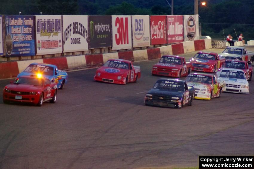 The field stays behind the pace car on a pace lap.