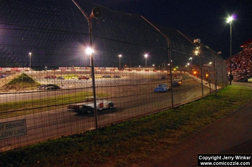 Cars come by under yellow conditions.