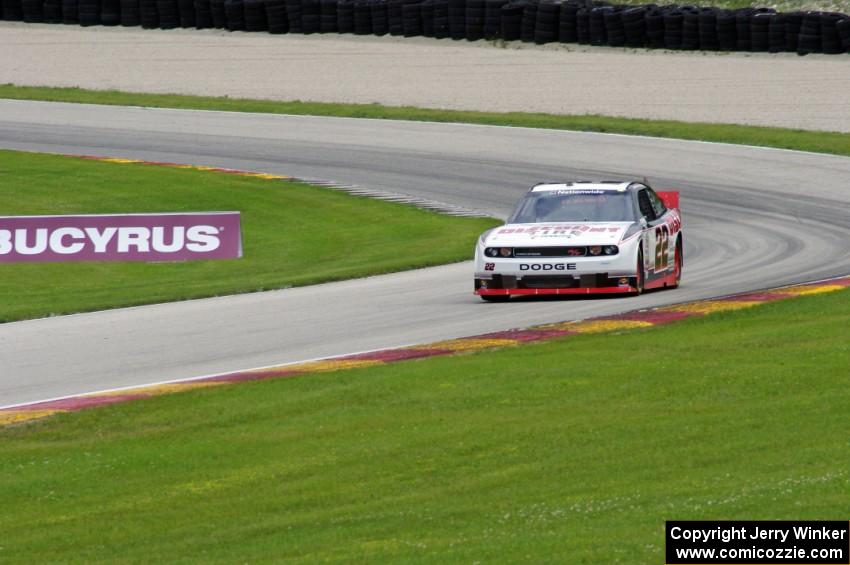 Jacques Villeneuve's Dodge Challenger exits the carousel