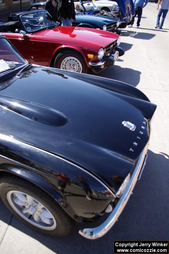 A Triumph TR-4 with two Triumph TR-6's