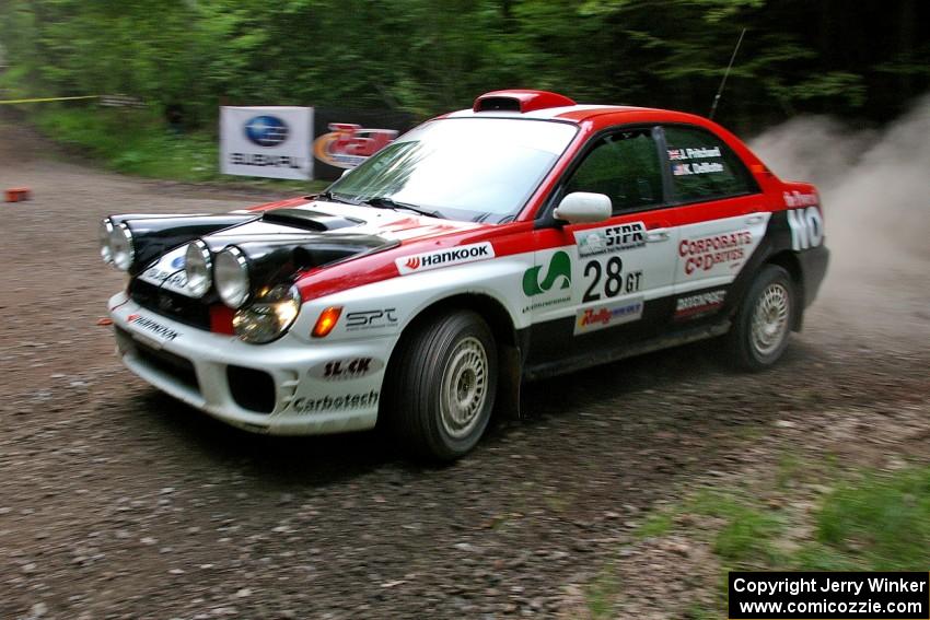 Justin Pritchard / Kim DeMotte Subaru WRX at a hairpin on SS6.