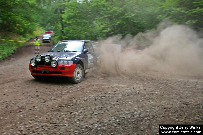 Chris Sanborn / Chris Stark Ford Escort Cosworth goes wide at a hairpin on SS6.