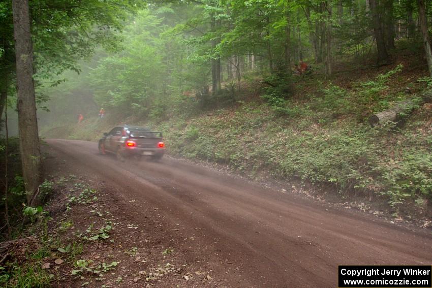 Josh Chang / Donald DeRose Subaru WRX STi blast uphill through the dust on SS6.