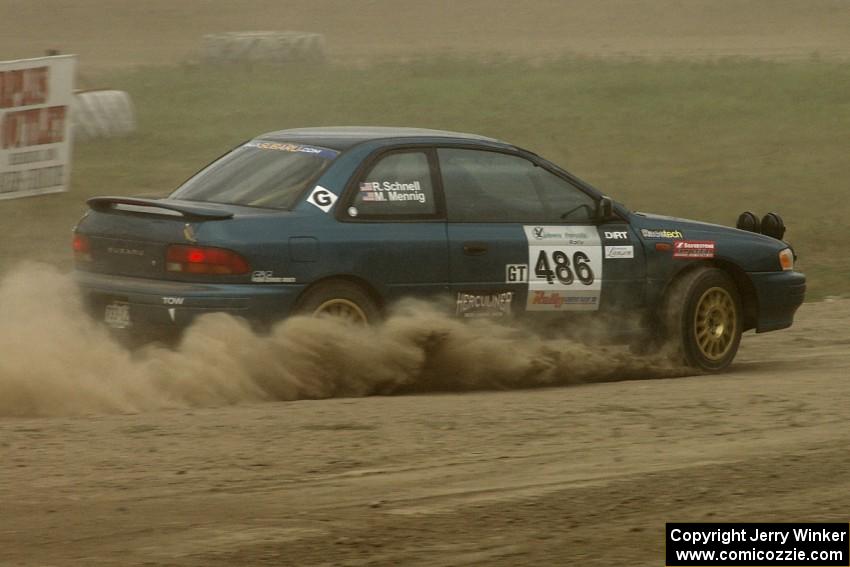 Martin Mennig / Ryan Schnell Subaru Impreza was barely visible through all the dust on SS1.