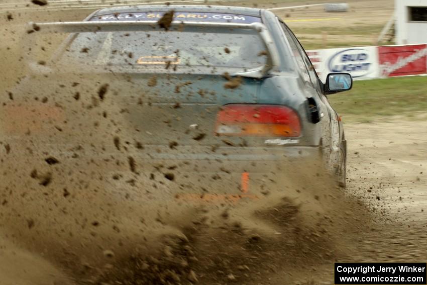 Jaroslaw Sozanski / Ben Slocum Subaru Impreza slings mud on SS1.