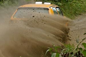 Chad Eixenberger / Jay Luikart VW Golf slings gravel on SS9 at the spectator point.