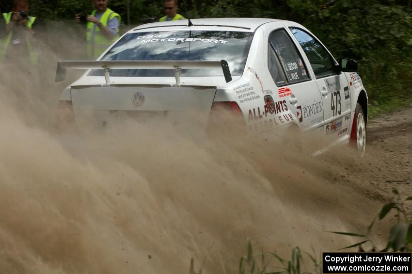 The Lars Wolfe / Jeff Secor VW Jetta Turbo slings gravel at spectators on SS9.