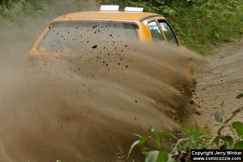 Chad Eixenberger / Jay Luikart VW Golf slings gravel on SS9 at the spectator point.