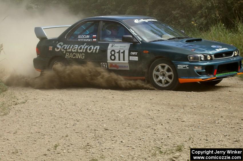 Jaroslaw Sozanski / Ben Slocum Subaru Impreza slings gravel at the SS9 spectator point (1).