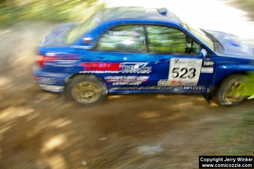 Travis Hanson / Terry Hanson Subaru Impreza WRX at speed on SS12.