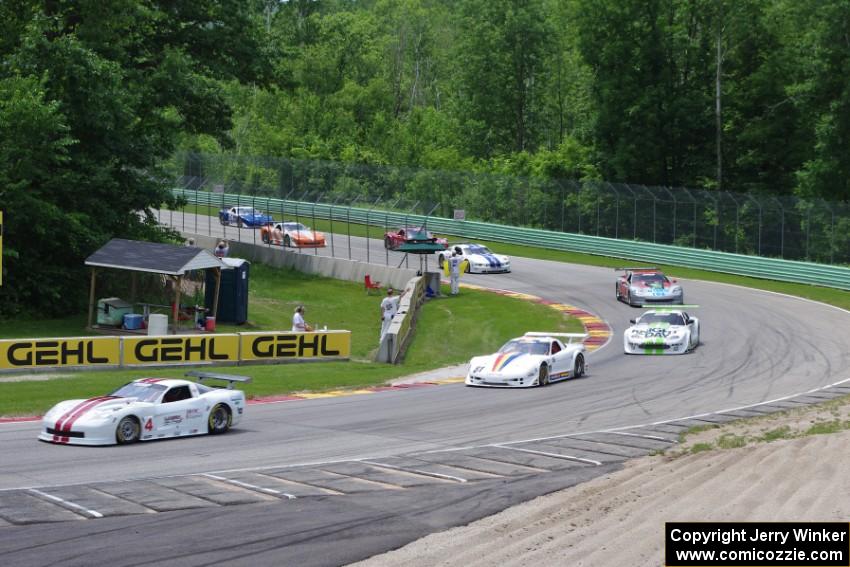 Front end of the field comes through Canada Corner on the pace lap.