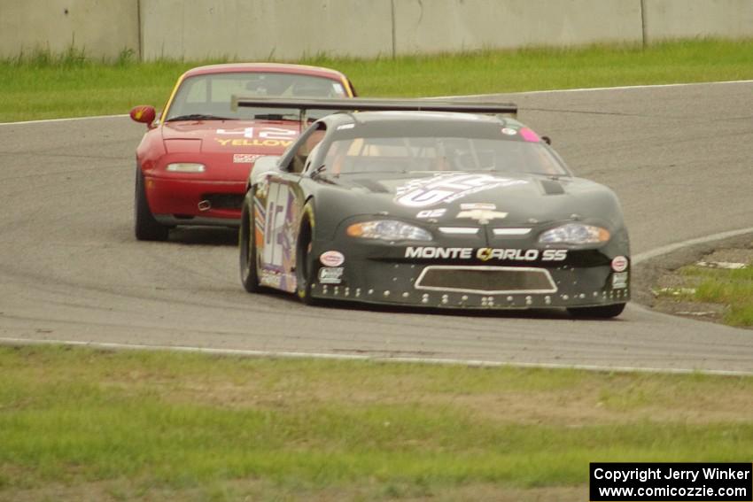 George Prentice, Jr.'s SPO Chevy Monte Carlo and Greg Youngdahl's Spec Miata Mazda Miata