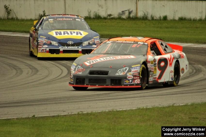 Austin Dyne's Ford Taurus and Eric Holmes' Toyota Camry