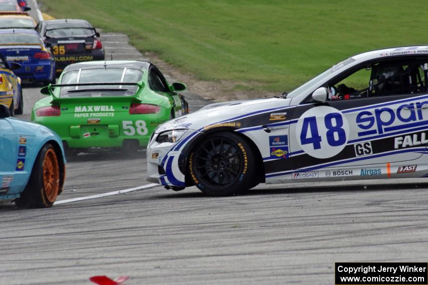 Charles Espenlaub / Charlie Putman BMW M3 Coupe waits as the GS field heads uphill from turn 5 on the first lap.