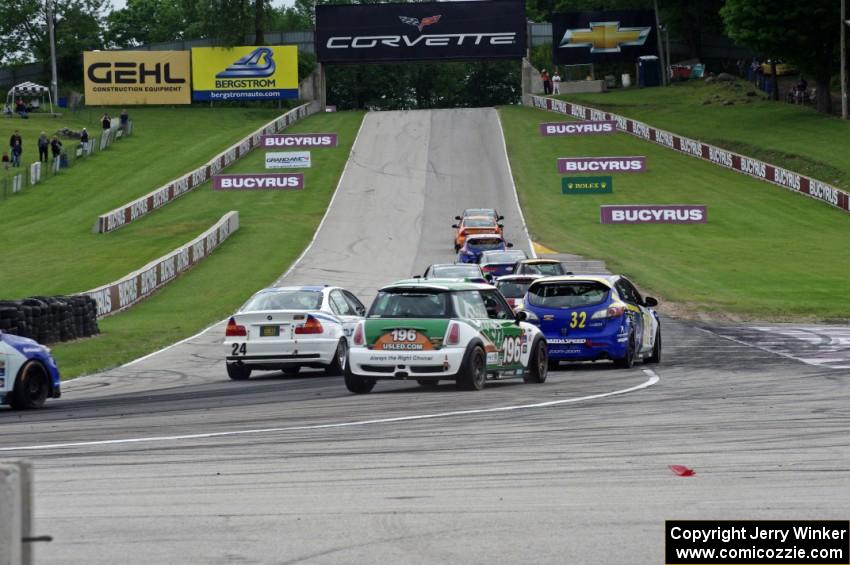 The ST field heads uphill from turn 5 on the first lap.