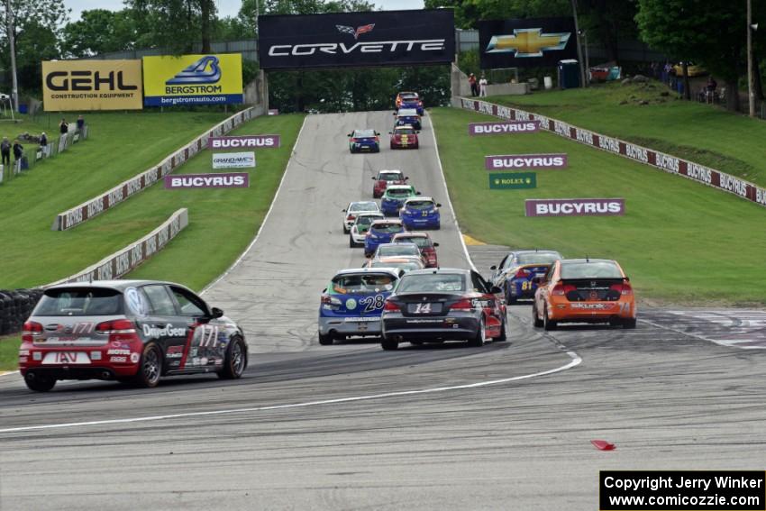 The ST field heads uphill from turn 5 on the first lap.