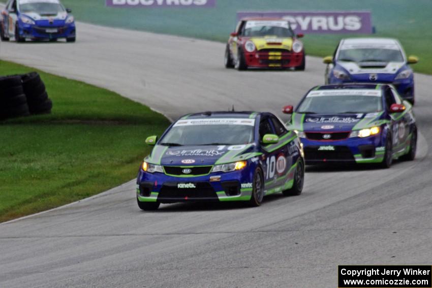 Mike Galati / Nic Jonsson and Adam Burrows / Trevor Hopwood KIA Forte Koups lead the other ST cars