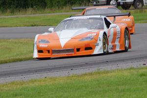 Simon Gregg's Chevy Corvette leads Jim Derhaag's Chevy Corvette