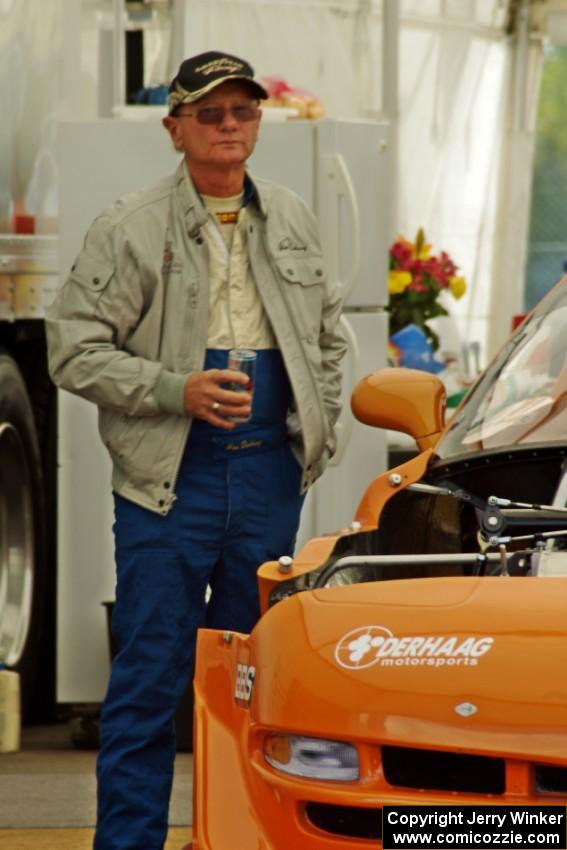 Jim Derhaag next to his Chevy Corvette