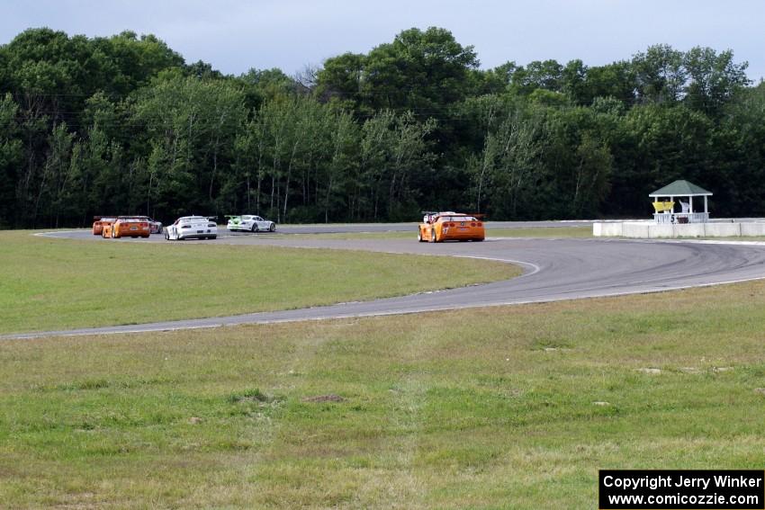 Tony Ave leads Tomy Drissi, R.J. Lopez, Simon Gregg, Jim Derhaag, Buddy Cisar and Bobby Sak on the pace lap into turn 5.