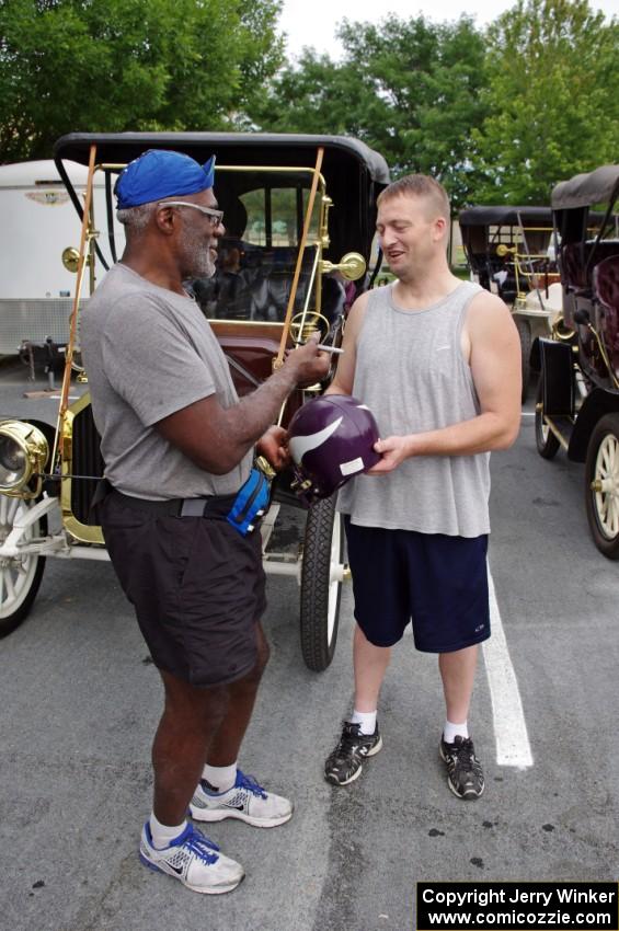 Alan Page signs an autograph for a fan