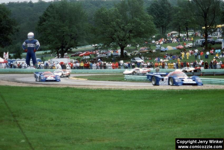 The field comes through turn 5 on the pace lap