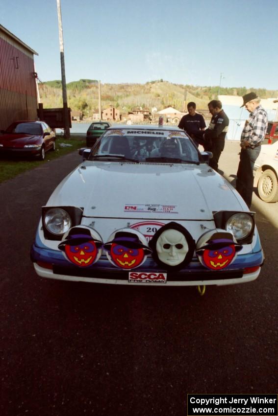 Mike Hurst / Rob Bohn Mazda RX-7 at parc expose outside Dee Stadium.