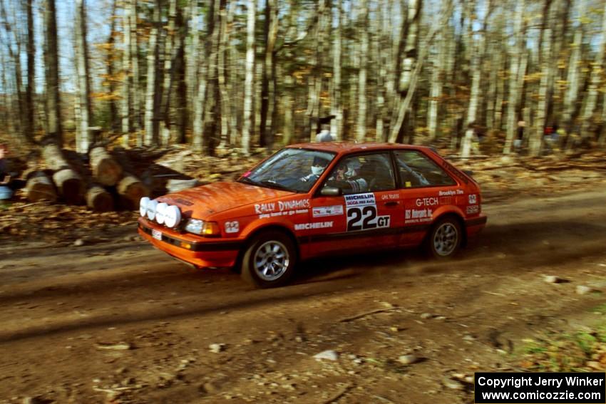 Gail Truess / Pattie Hughes Mazda 323GTX near the flying finish of SS1, Beacon Hill.