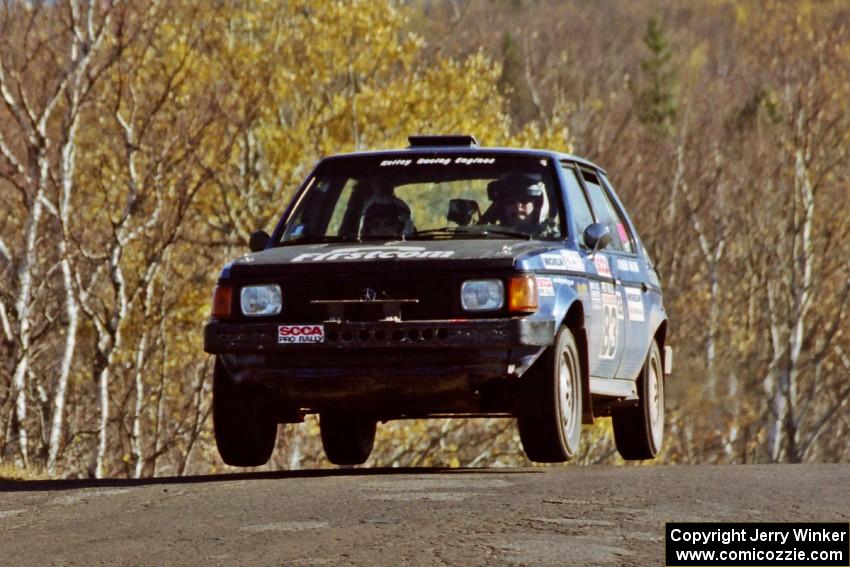 Mark Utecht / Brenda Corneliusen Dodge Omni GLH-Turbo catches some air at the final yump on SS13, Brockway I.