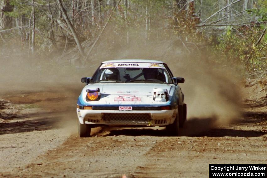 Mike Hurst / Rob Bohn Mazda RX-7 at speed near the finish of SS15, Gratiot Lake II.