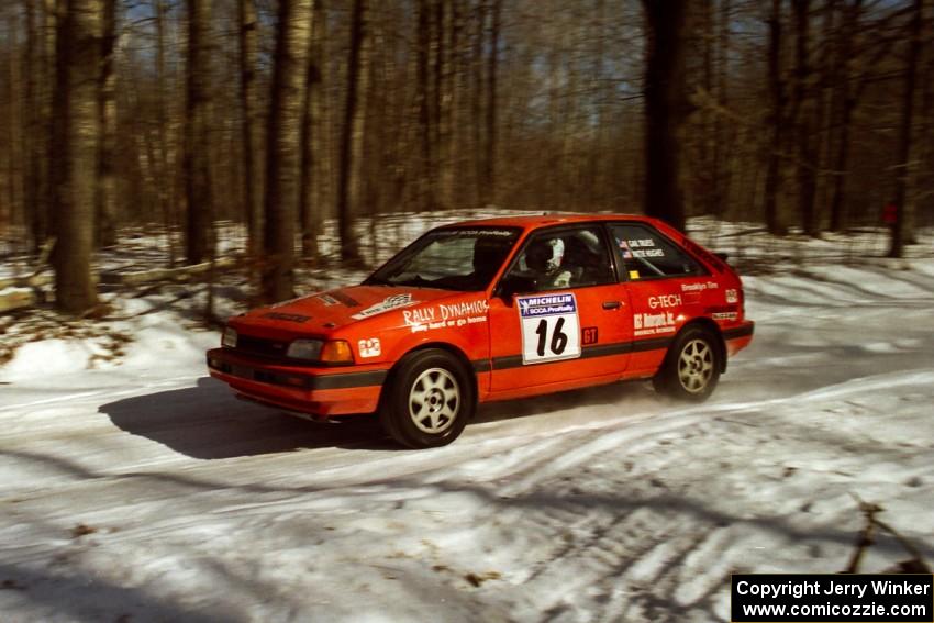 Gail Truess / Pattie Hughes at speed on SS3 in their Mazda 323GTX.