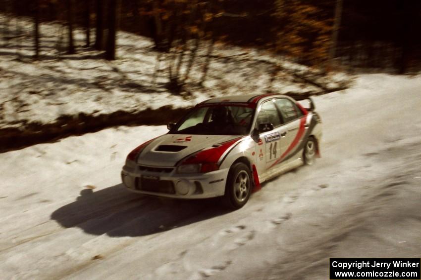 Garen Shrader / Doc Schrader limp through SS3 at speed with a flat right-rear on their Mitsubishi Lancer Evo IV.