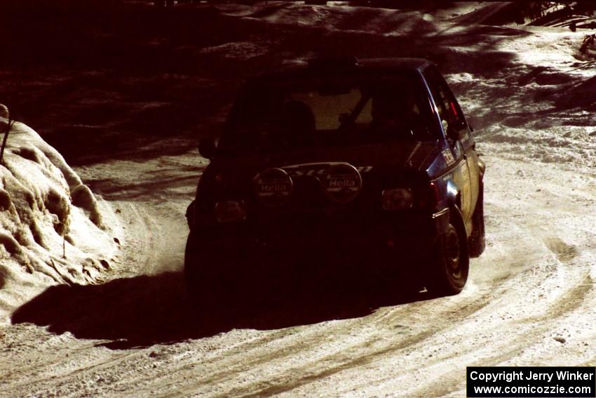 Mark Utecht / Diane Sargent Dodge Omni GLH takes a smooth line through a slippery corner on the stage after the lunch break.