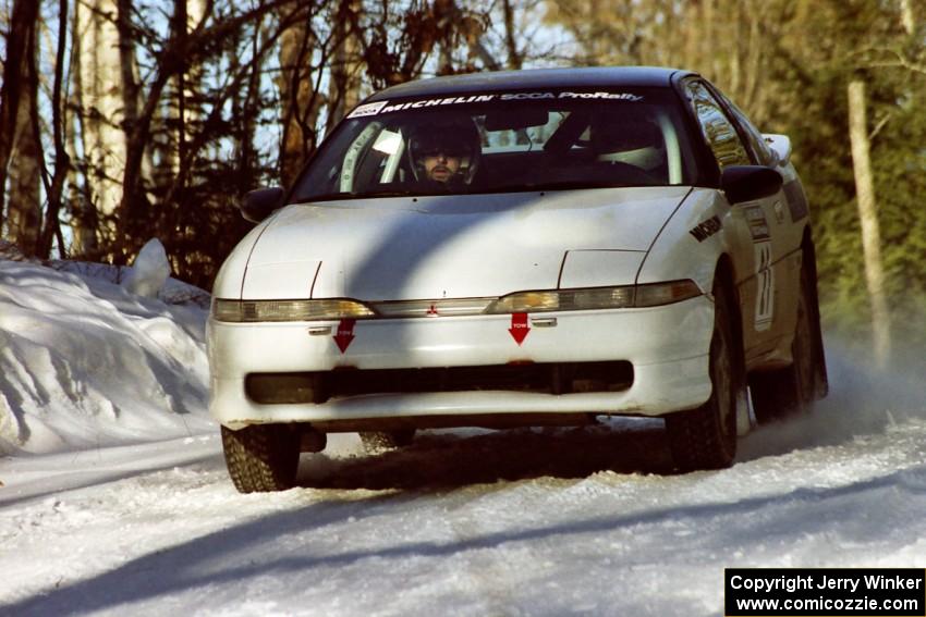 Chris Czyzio / Eric Carlson Mitsubishi Eclipse at speed over a crest before sundown.