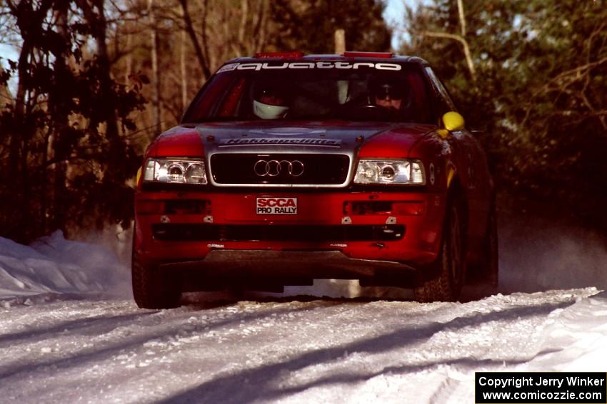 John Rek / Clark Bond Audi Quattro S2 at speed over a crest before sunset.