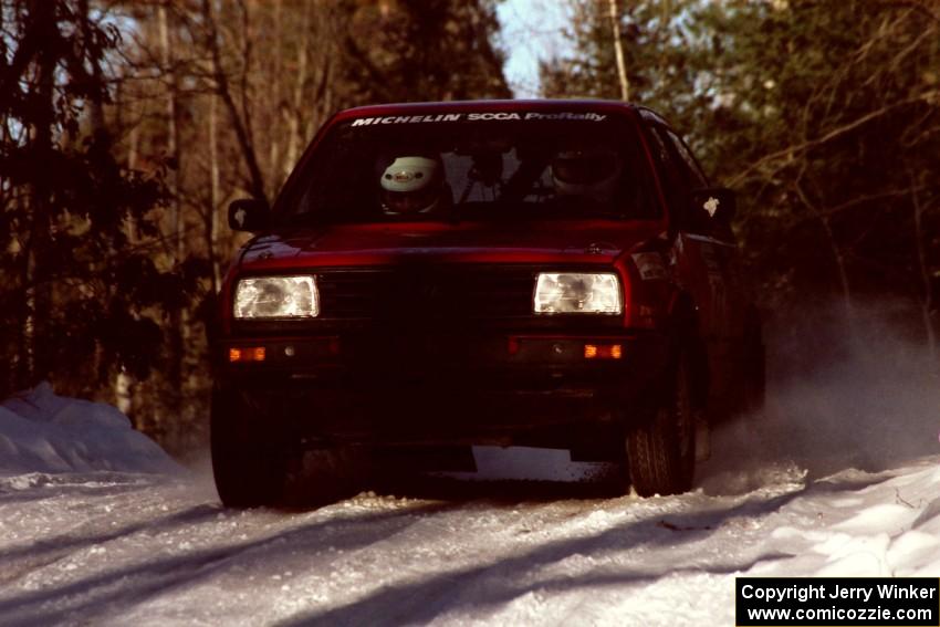 Brian Vinson / Richard Beels VW GTI at speed over a crest before sunset.