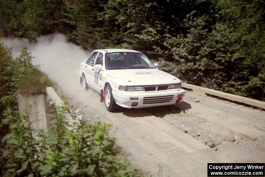 Seamus Burke / Mark Williams Mitsubishi Galant VR-4 at speed over a bridge on SS5, Magalloway North.