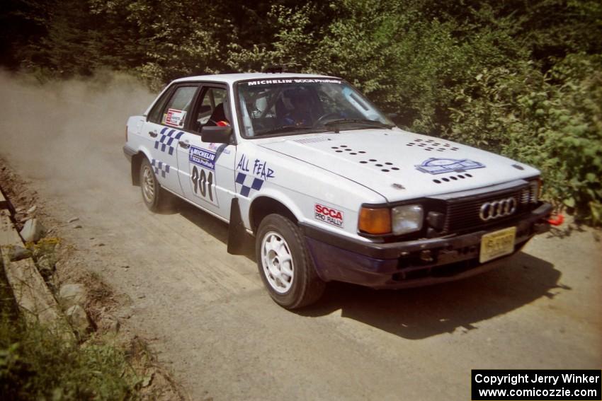 Gerry Brinkman / Will Sekella Audi 4000 Quattro at speed over a bridge on SS5, Magalloway North.