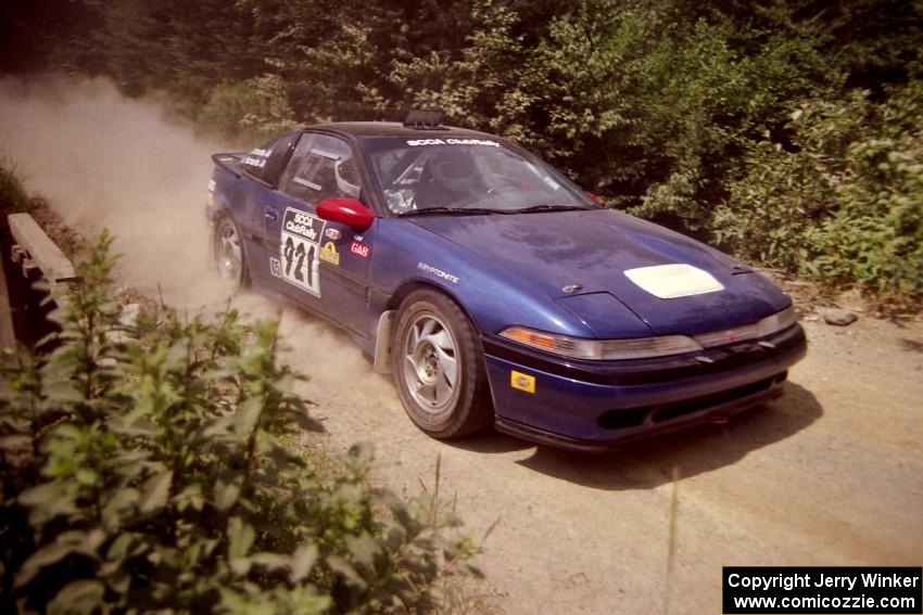 Howie Richards / Joel Richards Mitsubishi Eclipse at speed over a bridge on SS5, Magalloway North.