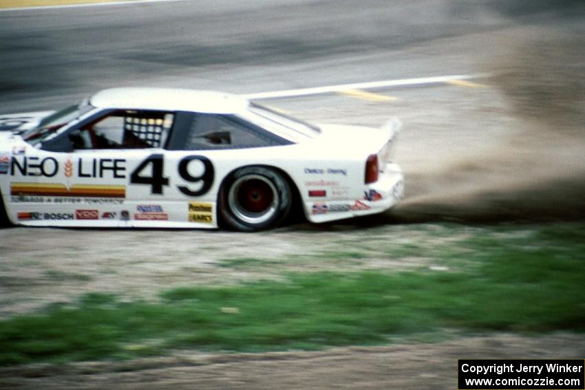 Jerry Brassfield's Olds Cutlass Supreme gets back onto the track just prior to colliding with Paul Newman's similar car.