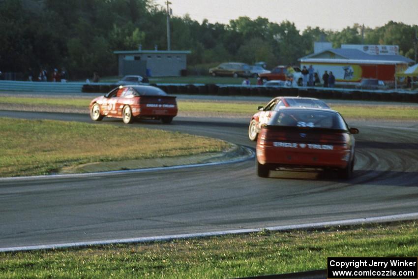 Tommy Archer's Eagle Talon ahead of Norris Rancort's Honda CRX Si and Mitch Wright's Eagle Talon