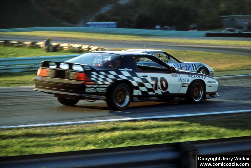 Andy Pilgrim's Chevy Corvette makes an inside pass on Lou Gigliotti's Chevy Camaro