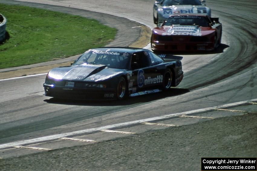 Irv Hoerr's Olds Cutlass Supreme ahead of Steve Saleen's Ford Mustang and John Heinricy's Chevy Corvette