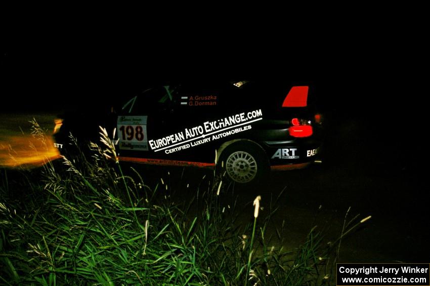 Arkadiusz Gruszka / Grzegorz Dorman exit out of a 90-left on SS6 in their Subaru WRX STi.