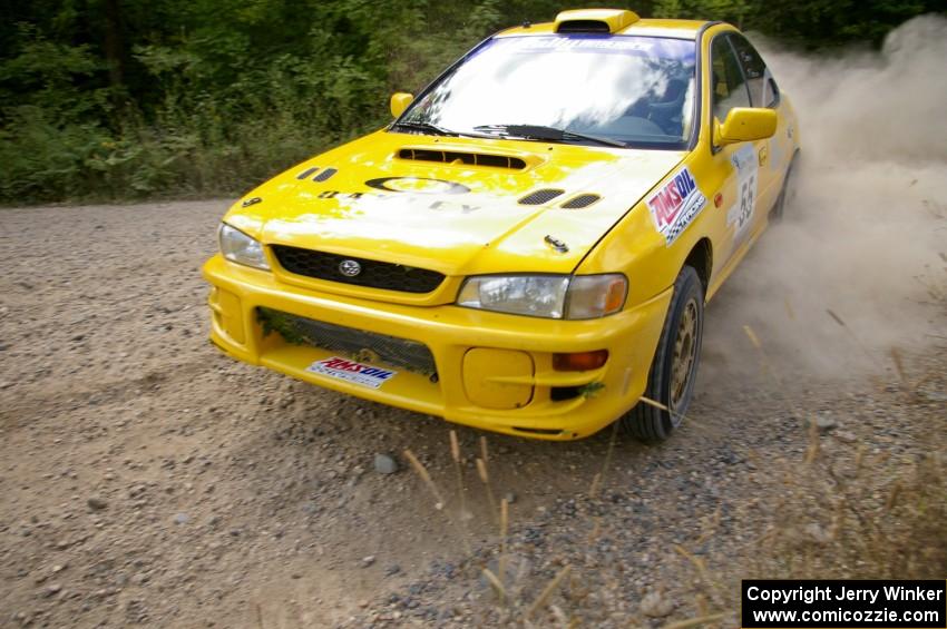 The Subaru Impreza of Kyle Sarasin / Mikael Johansson drift through a fast left-hander on SS10.