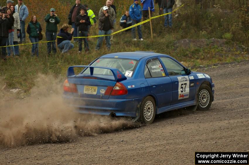 The Dmitri Kishkarev / Kim DeMotte Mitsubishi Lancer Evo IV accelerates hard out of the spectator point of SS1, Green Acres.