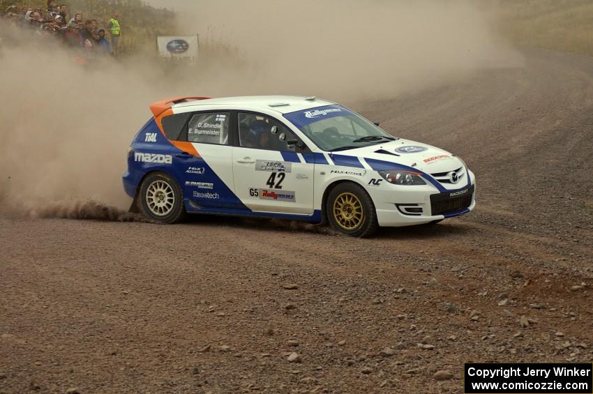 Eric Burmeister / Dave Shindle throw their Mazda Speed 3 hard into the spectator corner on SS1, Green Acres.