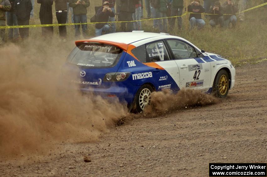 Eric Burmeister / Dave Shindle blast their Mazda Speed 3 out of the spectator corner on SS1.