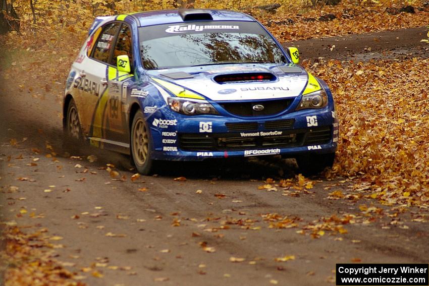 Travis Pastrana / John Buffum fly through a left sweeper at the end of Beacon Hill, SS2, in their Subaru WRX STi.