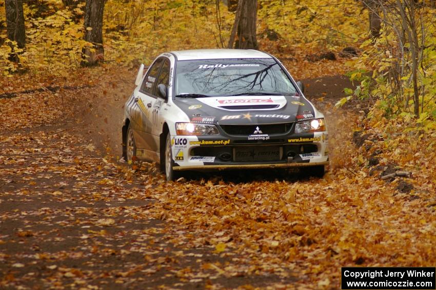 Andi Mancin / Maciej Wislawski drift their Mitsubishi Evo 9 through a sweeper on SS2, Beacon Hill.